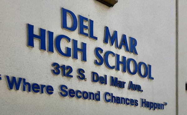 names of a high school on a wall