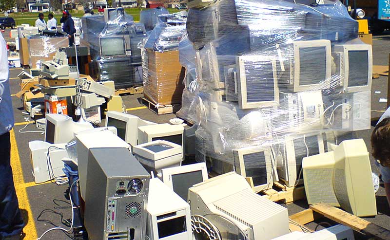 a stack of old computers shrink-wrapped