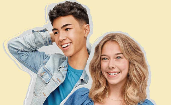 a teen boy and girl admiring their hair