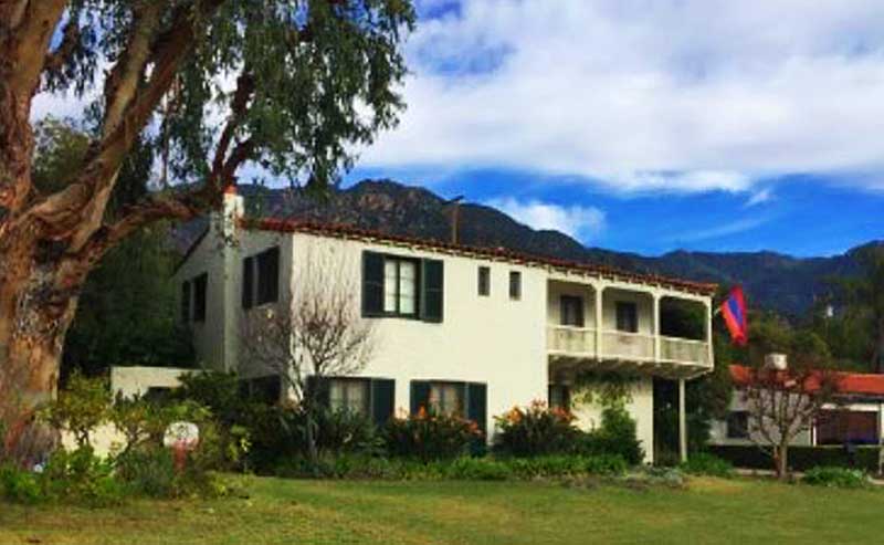 A house surrounded by green lawn
