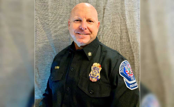 A man in uniform smiling