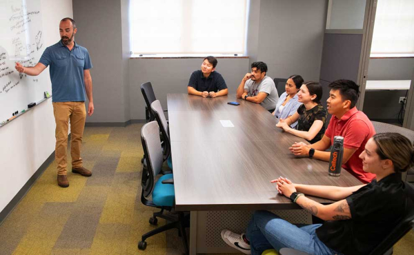 College students and a professor in a classroom