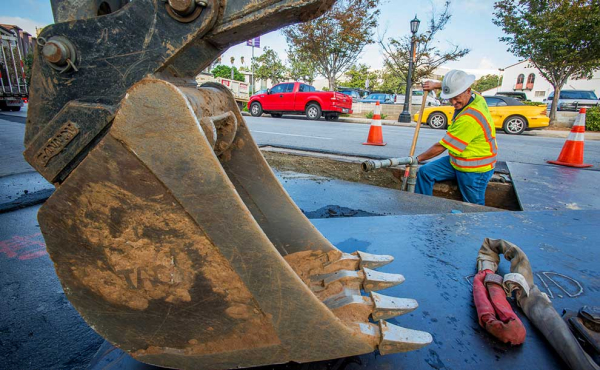 a worker doing construction on the street