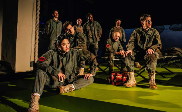 a group of actors in military outfits