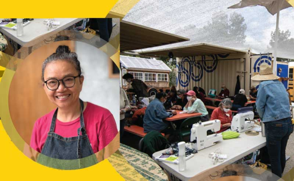 a person smiling next to students learning silk screening