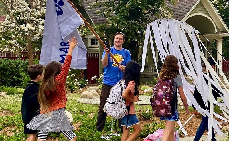 kids walking on a sidewalk