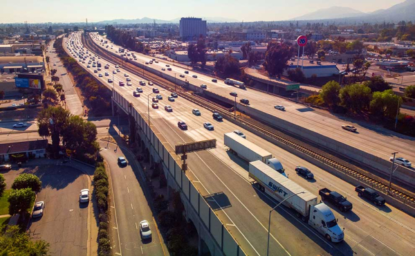 A freeway with trucks and cars
