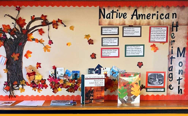 a display of tree branches and fall and Native American artifacts