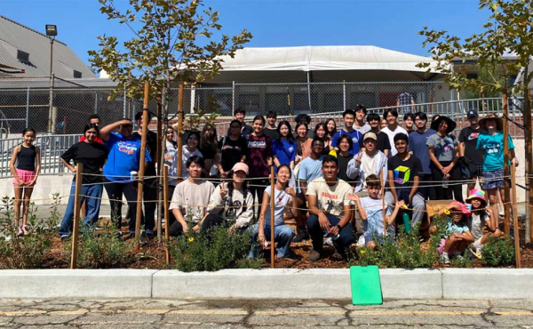 group of parents and students gather for a photo