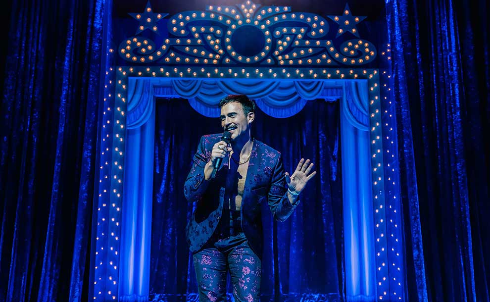 a man singing on stage