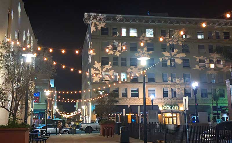 a building with holiday projection on it