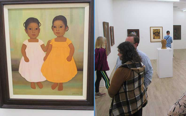 a painting and people attending a reception