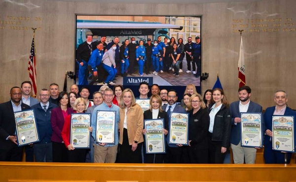 a woman surrounded by people holding proclamations