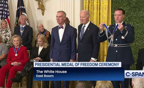 people in a room with medals