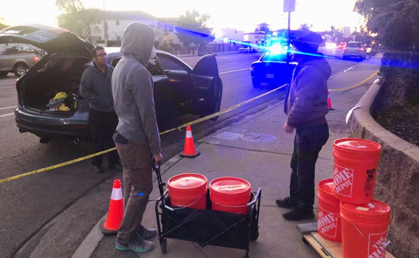 a person with buckets filled with water