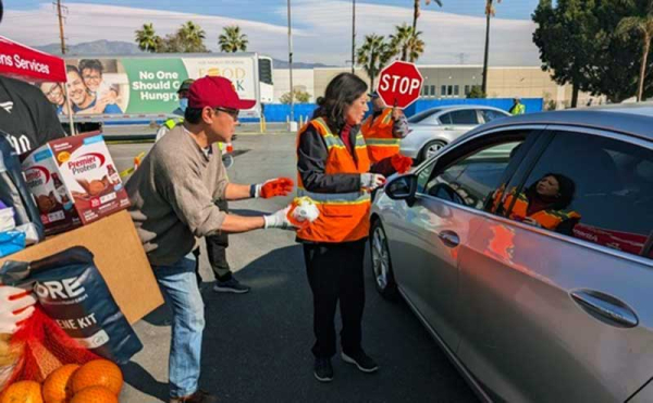 a woman giving out food