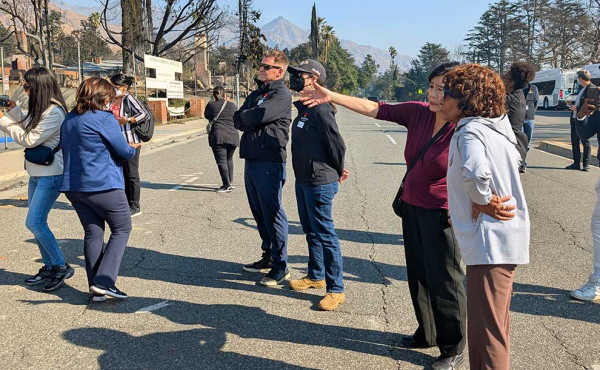 people surveying damage
