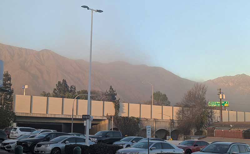 mountain top covered with debris and soot