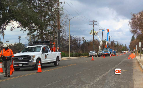 trucks fixing electric poles