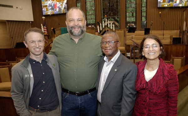 a group photo of people smiling