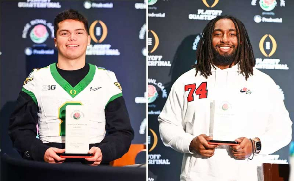 two players holding trophies