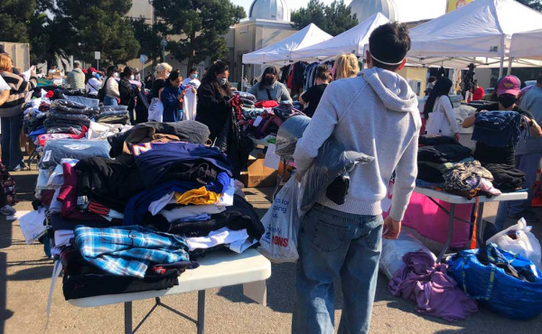 a guy holding a blanket