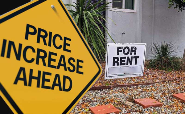 a sign that says price increase next to a for rent sign