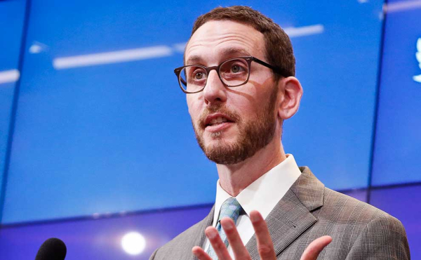 a person speaking from a podium