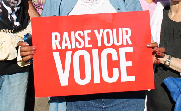people holding a sign