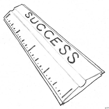 A ruler with the words "Success" printed on it