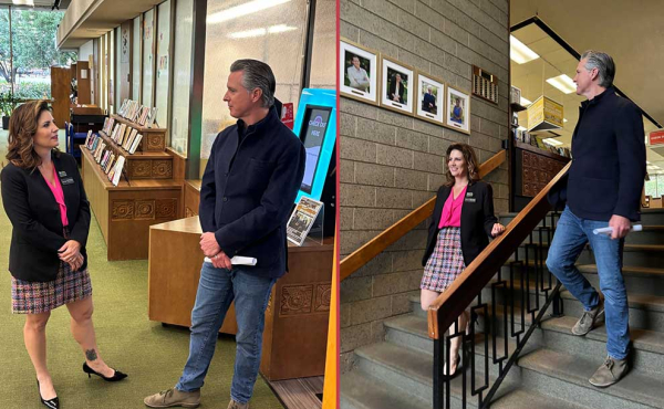 a man and a woman inspect a library