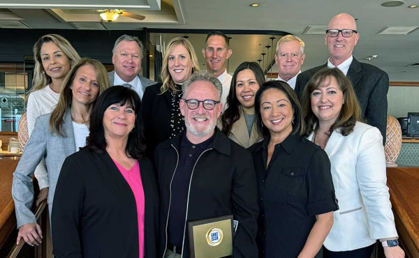 a group of people smiling to camera