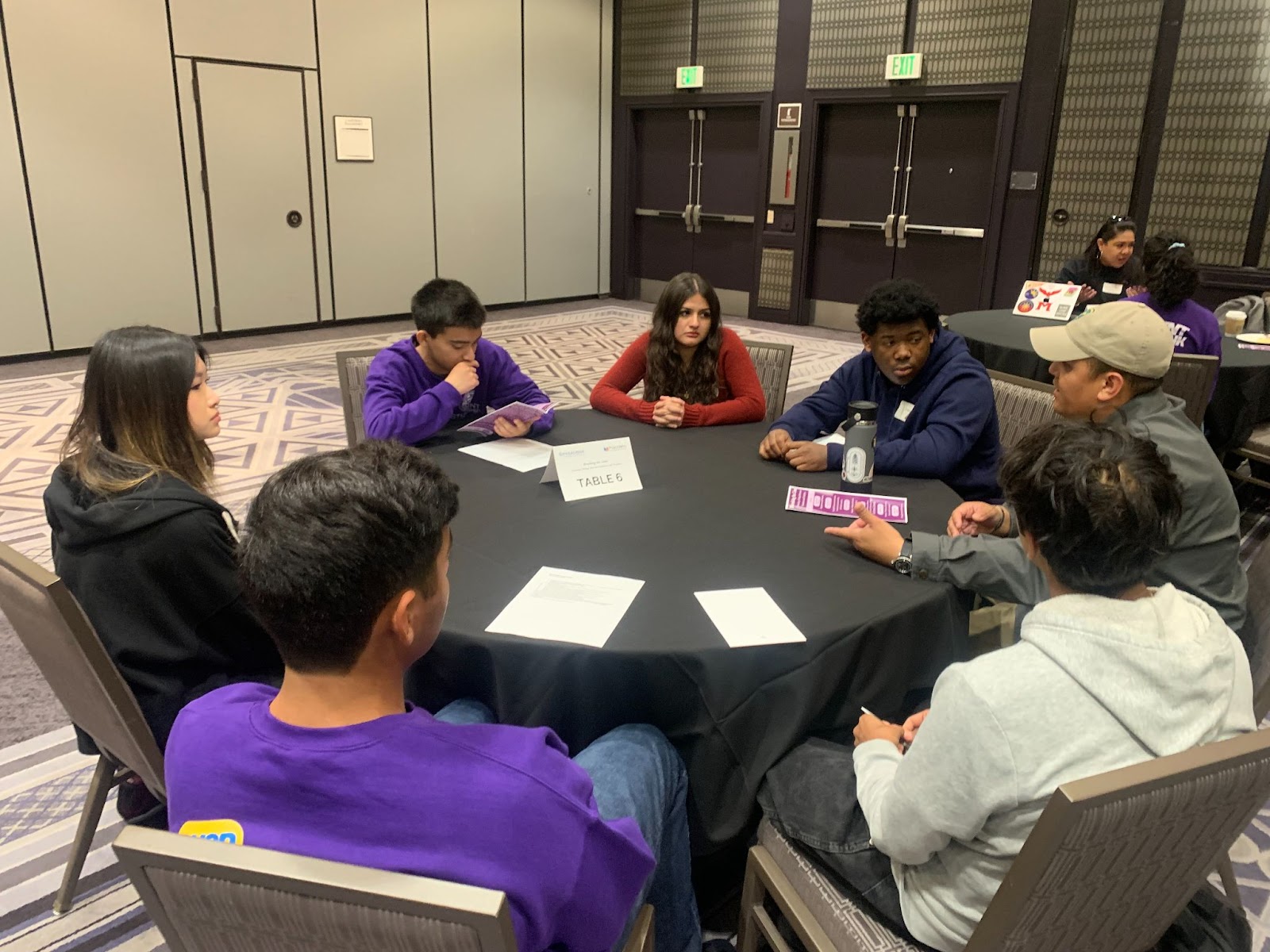 students in table discussion