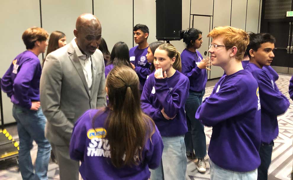 students talking with a person