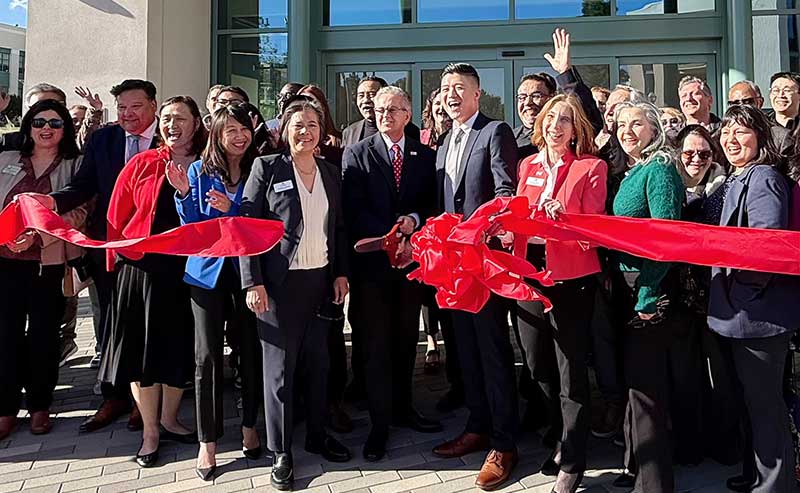 people cutting ribbon