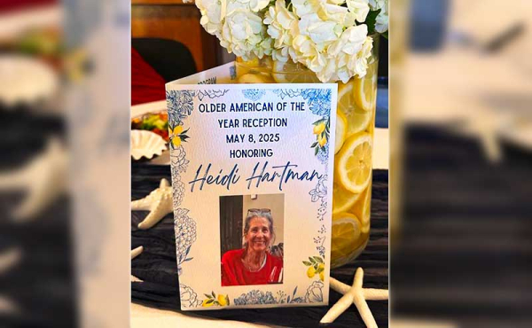 a card next to flowers