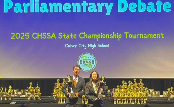 two students with awards