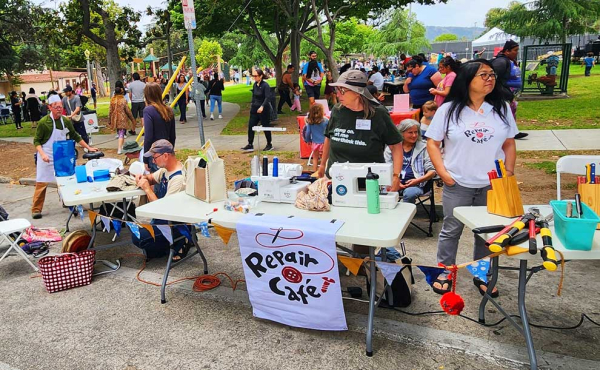 a table of people fixing things