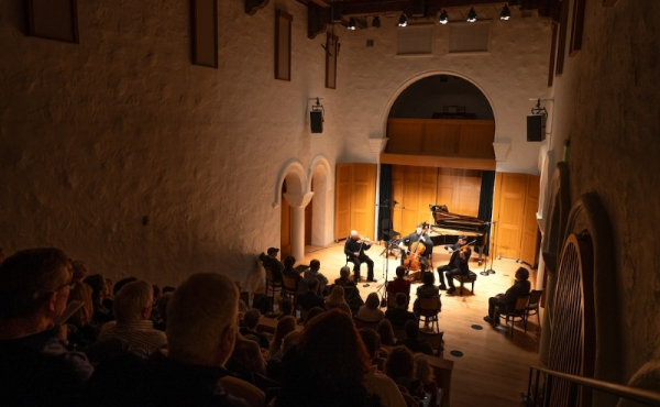 A concert hall with musicians on stage