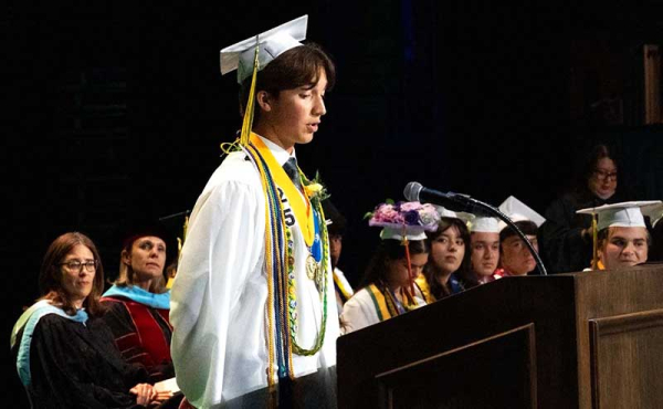 a student in cap and gown