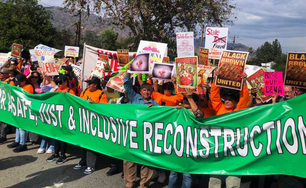 people holding a large banner