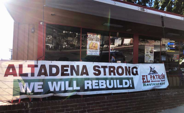 a sign by a restaurant