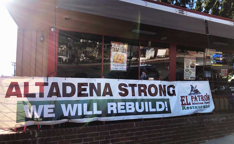 a sign by a restaurant