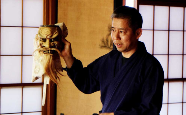 a man holding a mask