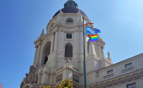 a pride flag on a pole