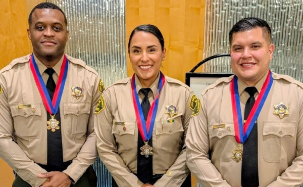 Three sheriffs smiling