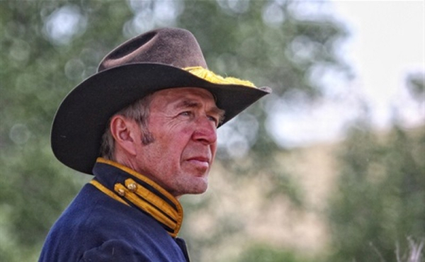 A man in a cowboy hat