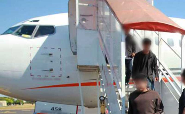 people descending from a plane