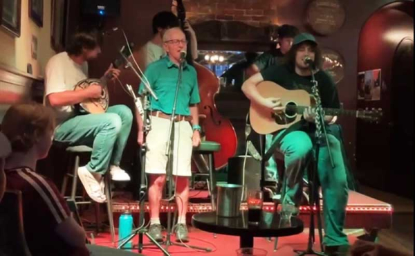 a man singing with a band