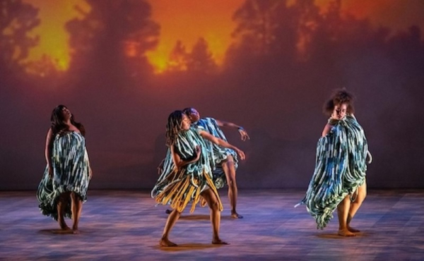 People in costume dancing on stage